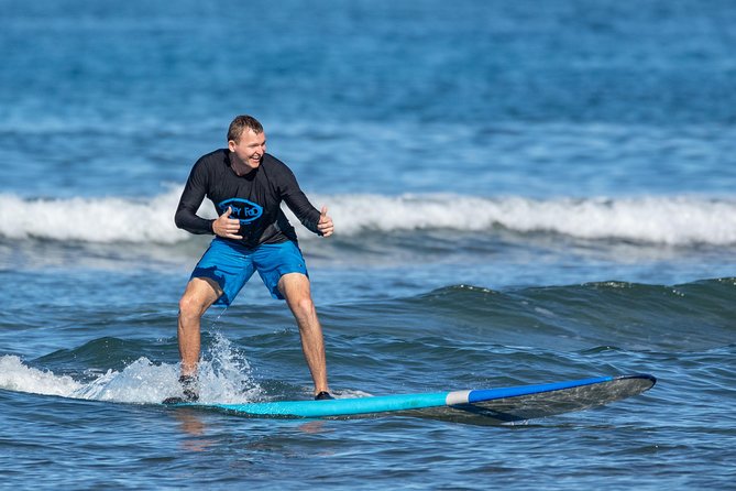 2 Hour Beginner Group Surf Lessons - Paddling out and catching your first wave