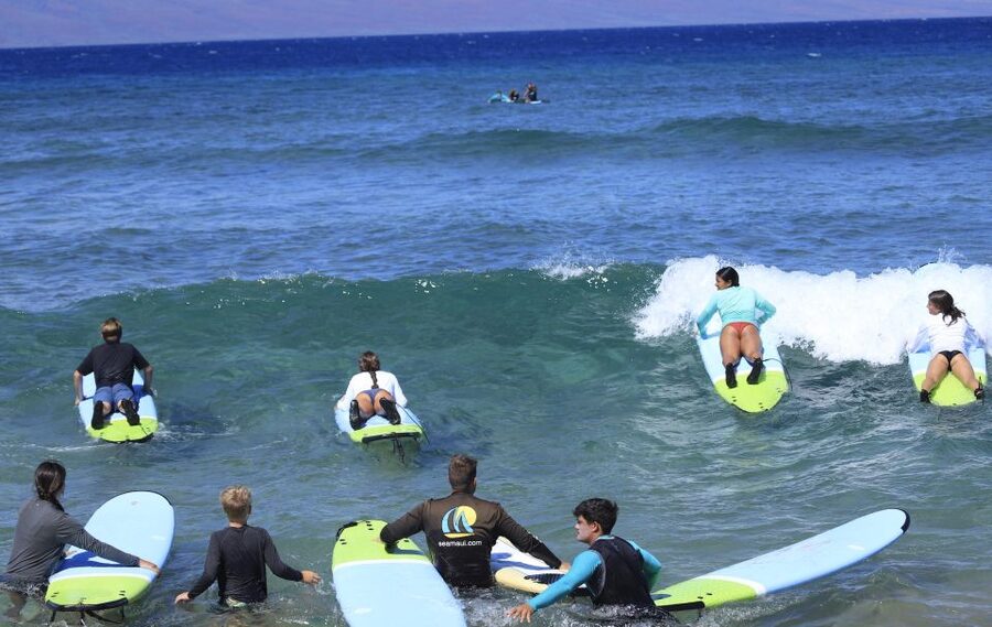 Maui: Group Surf Lesson - Paddling out and catching your first wave