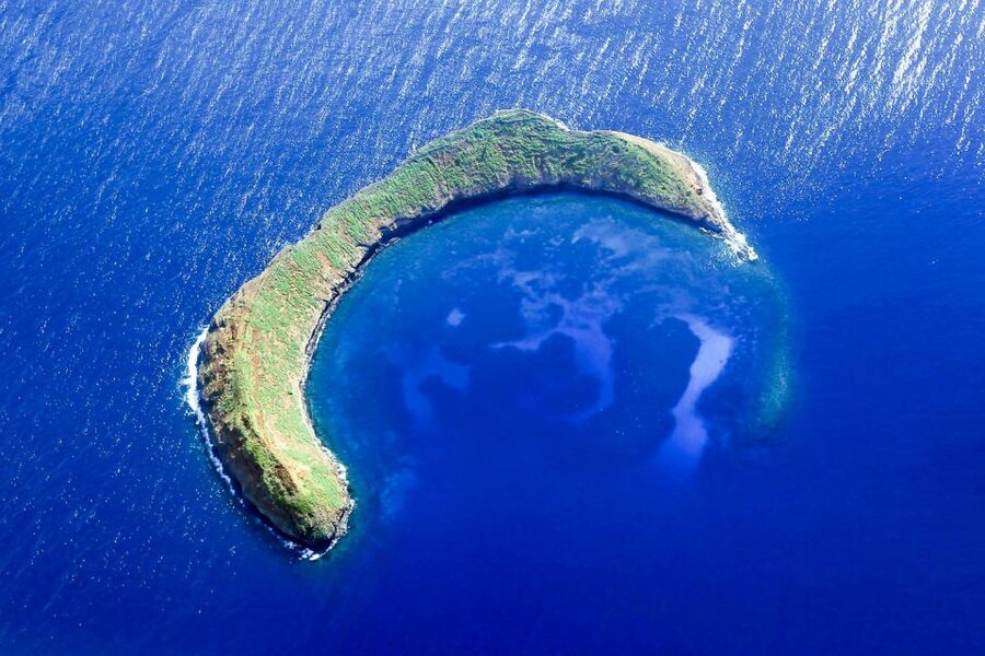The sunken crescent of Molokini crater in open water off south Maui