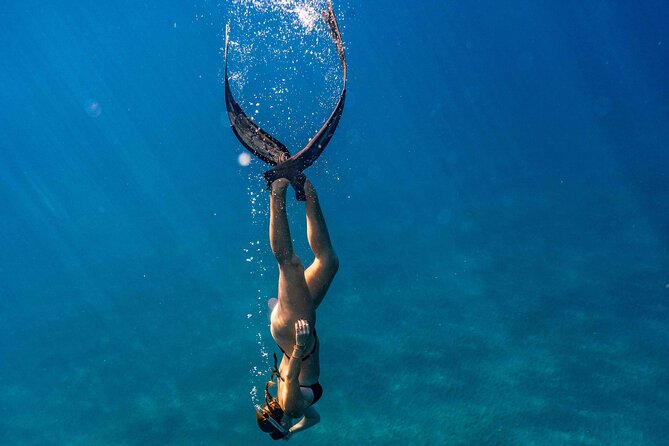 Two Site Snorkeling Adventure featuring the Molokini Crater - A small boat with a diver-first rhythm